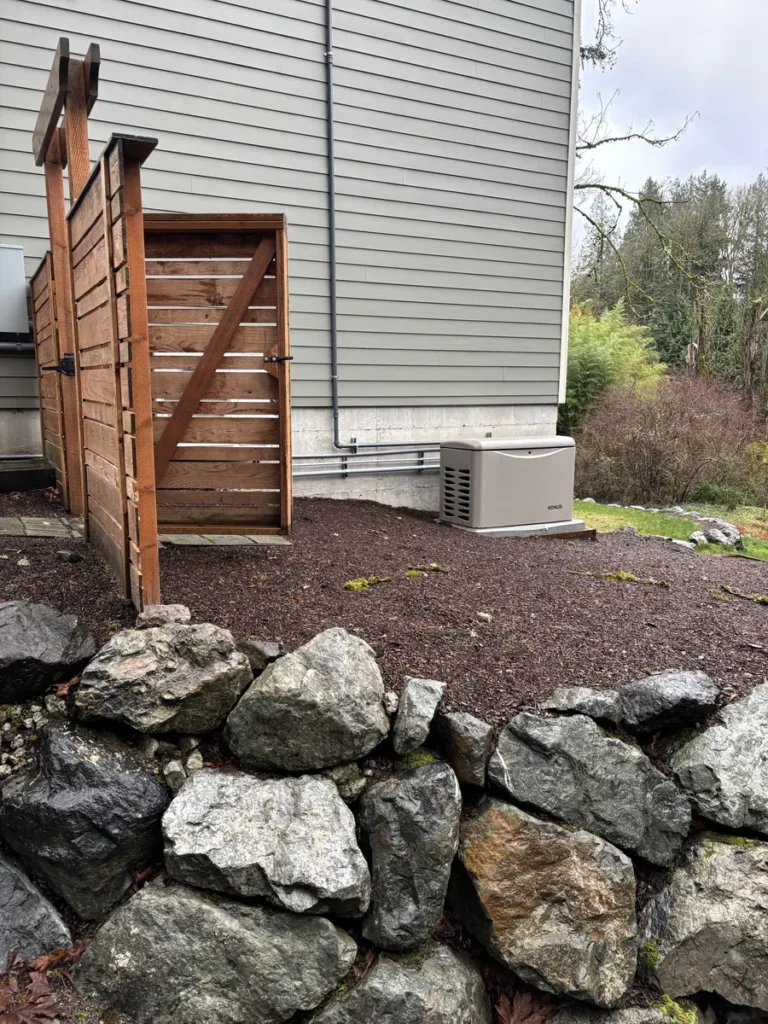 Outdoor standby generator beside a home