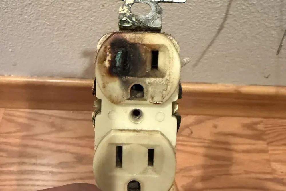 Heat damage on a removed electrical outlet